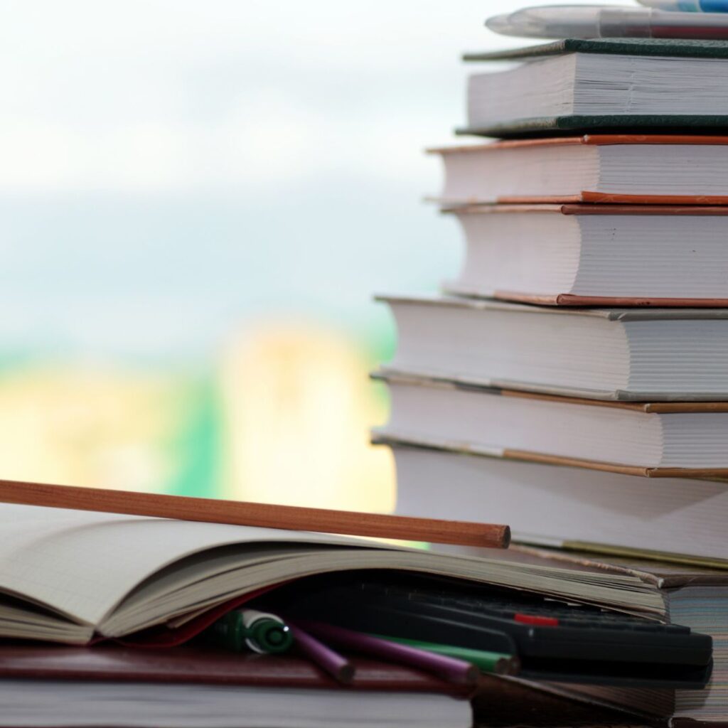 Four Ways EIW Can Help Your Child Improve Their Writing Skills 3 textbooks