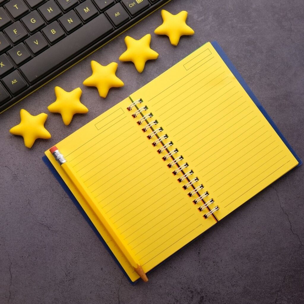 Stars and notebook next to keyboard